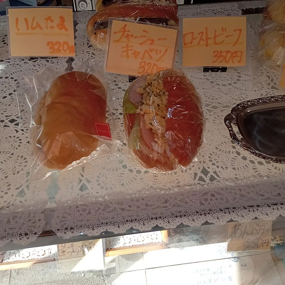 Filled bread rolls on display at Hatoya bakery in Kyojima.