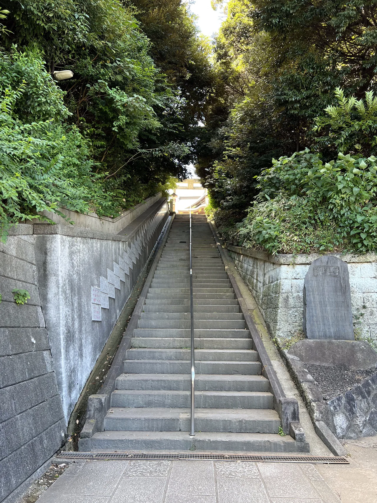 Stone steps climbing the wooded approach to Akabane Hachiman Shrine