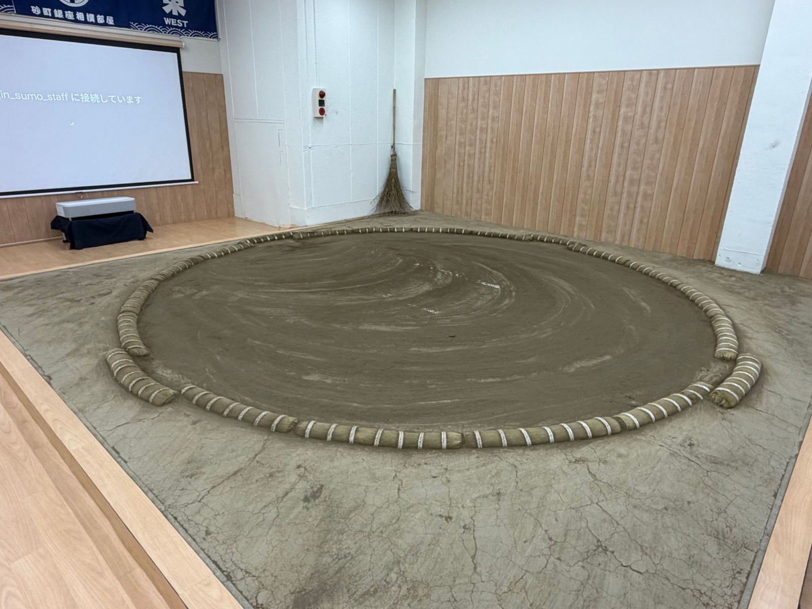 The dohyo at the Sunamachi Ginza Sumo Stable in Koto City, a full-size clay ring with straw tawara bales